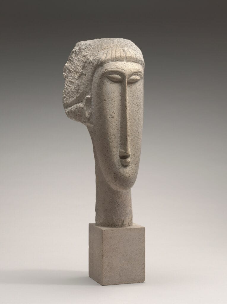 Cette oeuvre représente une tête de femme en pierre taillé par Amadeo Modigliani