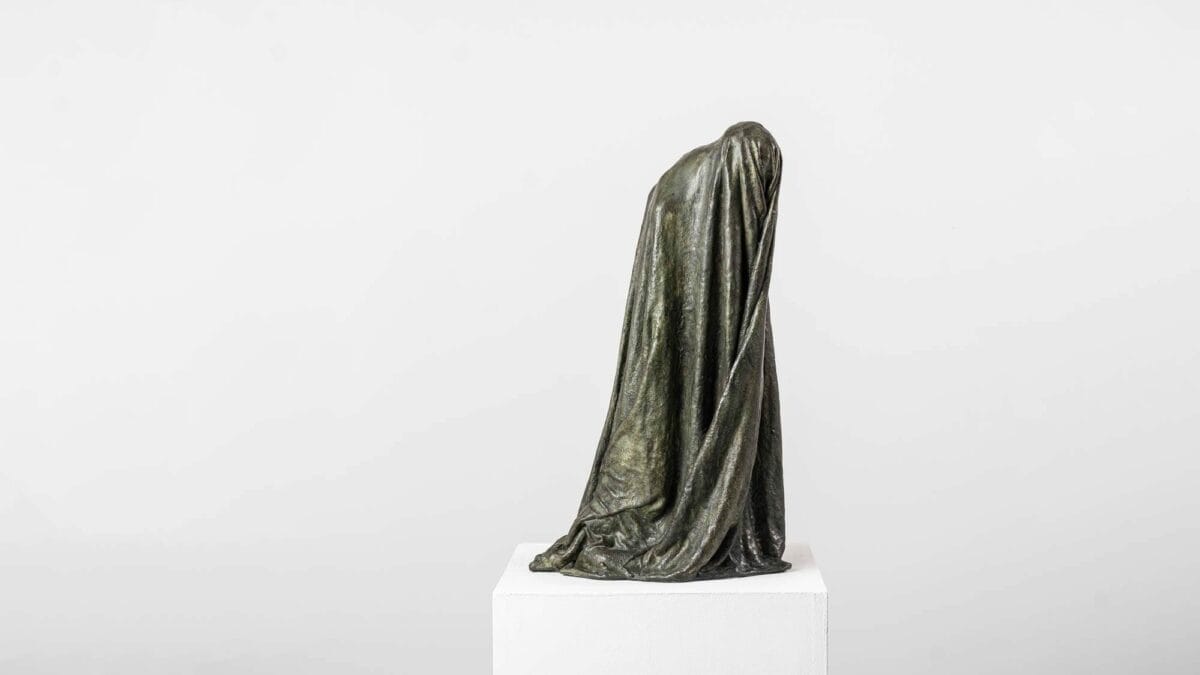 Guy Le Perse created "Veiled Shadow I", a bronze sculpture inspired by Dante's "Divine Comedy", illustrating a hypocrite tormented in the eighth circle of Hell.