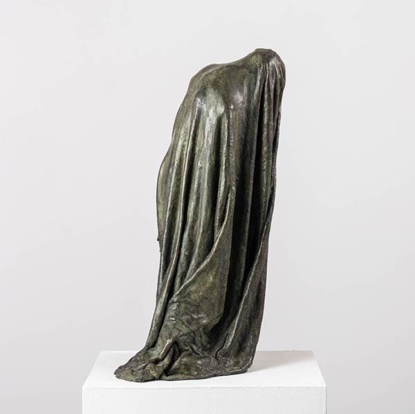 Created by Guy Le Perse, the bronze sculpture "Veiled Shadow I" draws inspiration from Dante's "Divine Comedy" to represent a hypocrite condemned in the eighth circle of Hell.
